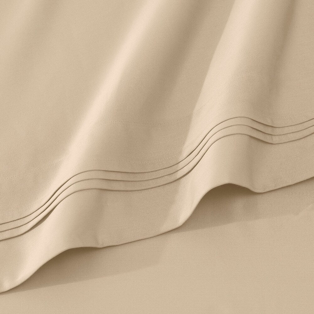 Jeu de draps uni en coton égyptien supérieur, 1000 fils, avec profonde poche.