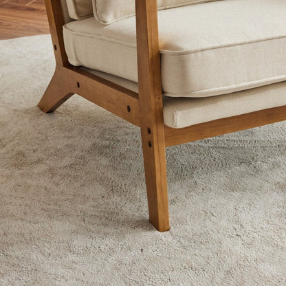 Fauteuil d'appoint en tissu mélangé de lin avec pieds en bois et un coussin beige.